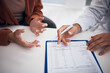 © Rene L/peopleimages.com - Doctor, hands and documents with patient in consultation for life insurance, policy or legal agreement at hospital. Closeup of medical employee showing paperwork, form or checklist on desk at clinic