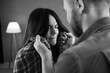 © Andrii Lysenko - Family violence problem concept. A husband roughly grabs his wife during an argument, close-up. Black and white photo