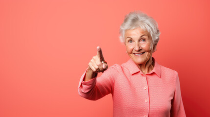 Wall Mural - Senior woman wearing casual clothes pointing with hand and finger to the side looking at the camera.