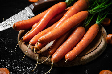 Carrots on a cutting board.