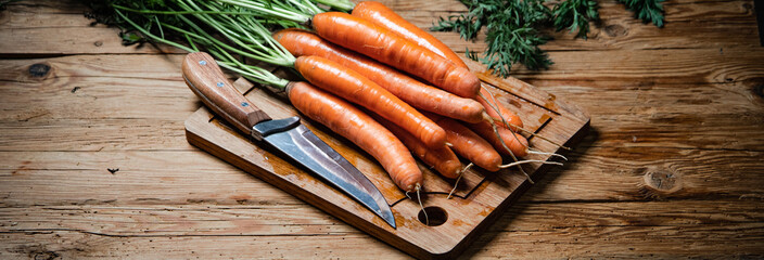 Sticker - Fresh carrots on wooden table.