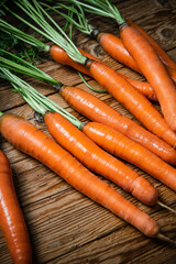 Poster - Fresh carrots on wooden table.