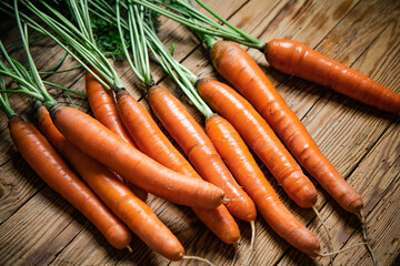 Poster - Fresh carrots on wooden table.