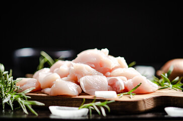 Canvas Print - Sliced chicken fillet. On cutting board.