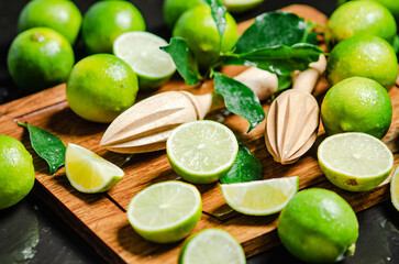 Sticker - Fresh limes. On black table.