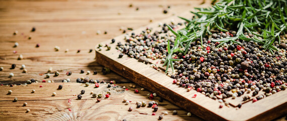 Wall Mural - Peppercorn on rustic background.