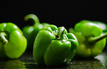 Wall Mural - Fresh sweet pepper. On black table.