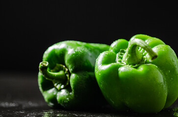 Poster - Fresh sweet pepper. On black table.