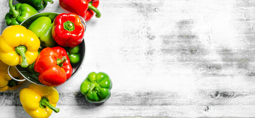 Wall Mural - Fresh sweet pepper. On white table.