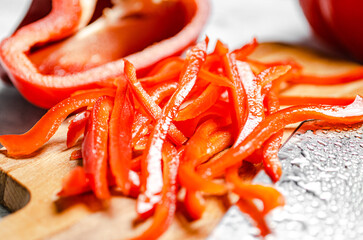 Poster - Chopped sweet pepper. On white table.