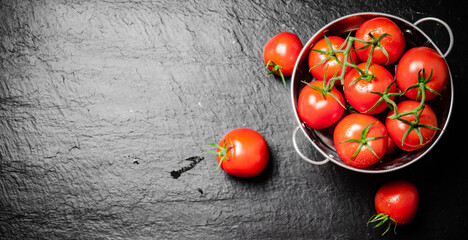 Sticker - Fresh tomatoes. On black table.