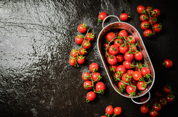 Poster - Fresh tomatoes. On black table.