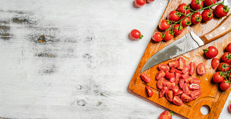 Sticker - Fresh chopped tomatoes. On white table.