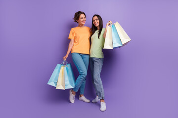 Canvas Print - Full length legs photo of two charming brunette hair girlfriends have fun friday sale zara boutique isolated on violet color background