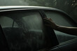 a hand is seen wiping off the fog that has built up on the inside of a car windshield, an everyday struggle on a humid morning