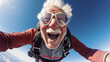 © ReneBot/Peopleimages - AI - Selfie of a skydiving senior man. Extreme sport fun retirement adventure