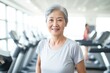 © kues1 - senior woman happy expression in a gym. fitness teacher concept.