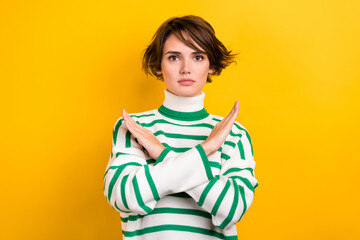 Sticker - Portrait of young serious woman bob brown hair wear striped stylish pullover crossed arms no stop sign isolated on yellow color background