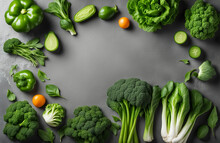 Variety Of Raw Green Vegetables On Grey Background. Copy Space
