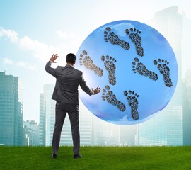 Carbon footprint concept with businessman