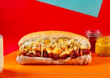 Hot Dog On Colored Hot Dog On Colored Background With Two Little Jars With Mustard And Ketchup.