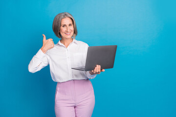 Canvas Print - Photo of shiny confident lady wear white shirt typing email modern gadget thumb up empty space isolated blue color background