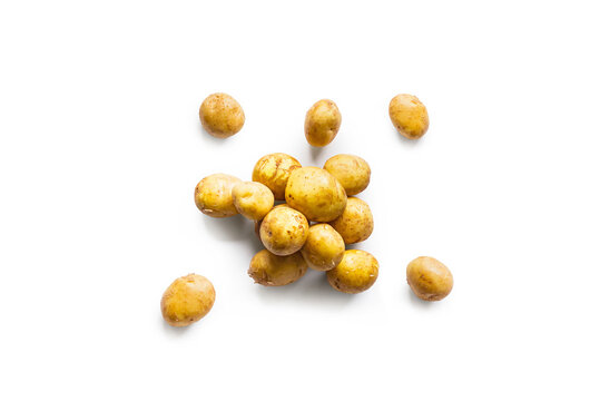 Closeup of a pile of fresh organic potatoes from the garden isolated on a white background from above, top view