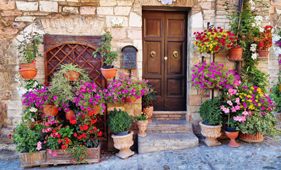 Wall Mural - Traditional old villages of Italy, Umbria - beautiful Spello town. Charming floral streets decoration