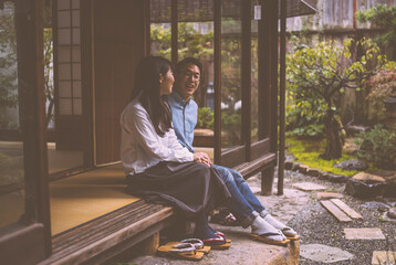 Wall Mural - Young japanese couple spending time in their house