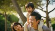 © DesignVectX - Happy pose of an Asian family in the park among the greenery
