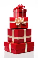 Stack Of Red Christmas Gift Boxes With Golden Ribbons Isolated On White