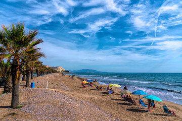 Sticker - Oropesa del Mar beach of Playa Morro de Gos with palm trees Costa del Azahar, Spain between Benicassim and Marina D`or