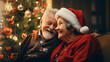happy and smiling grandparents spouse in their living room enjoying the magic of Christmas.
