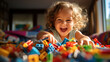 Happy little girl plays with plastic toy blocks, cute child having fun