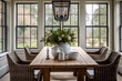 Bright country farmhouse dining room with rustic dining table and Wicker bucket chairs with large sash windows overlooking the country grounds
