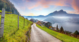 Fototapeta Natura - Captivating autumn view on suburb of Stansstad city and Lucerne lake with mountaines and fog