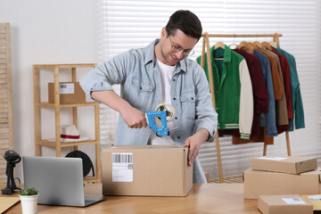 Poster - Seller taping parcel at workplace in office. Online store