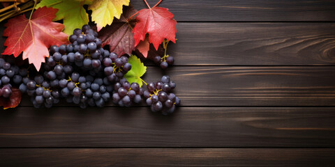 Canvas Print - Black juicy grapes on dark wooden background.