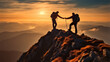 © visoot - Man helps his companion at the top of a mountain at sunset.