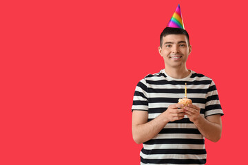 Sticker - Happy young man with birthday cake on red background