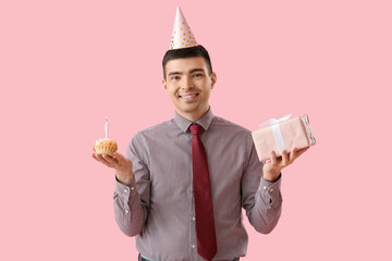 Sticker - Young man with birthday cake and gift on pink background