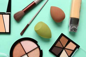 Composition with makeup accessories and decorative cosmetics on color background, closeup