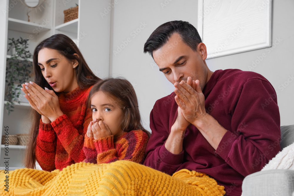 Frozen family at home with lack of heating