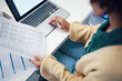 © Rene L/peopleimages.com - Closeup, finance and woman with documents, laptop and accounting with budget, planning and internet. Person, accountant and worker with a pc, paperwork and investment with payment and transactions