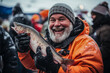 Winner hoisting large catch at a festive ice fishing competition 