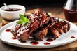 bbq ribs with tangy sauce dripping onto white plate