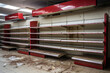 Empty shelves in a grocery store in an impoverished area, representing the scarcity of basic needs and food insecurity
