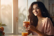 young Indian woman holding a glass of fresh juice