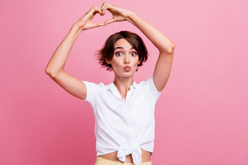 Poster - Photo of funky young girl showing heart symbol pouted lips sending air kiss all her onlyfans followers isolated on pink color background