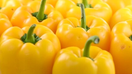 Poster - Yellow bell peppers close up, rotating background. Vegan vegetable sweet organic bell pepper backdrop. Fresh sweet organic bell pepper close up. 